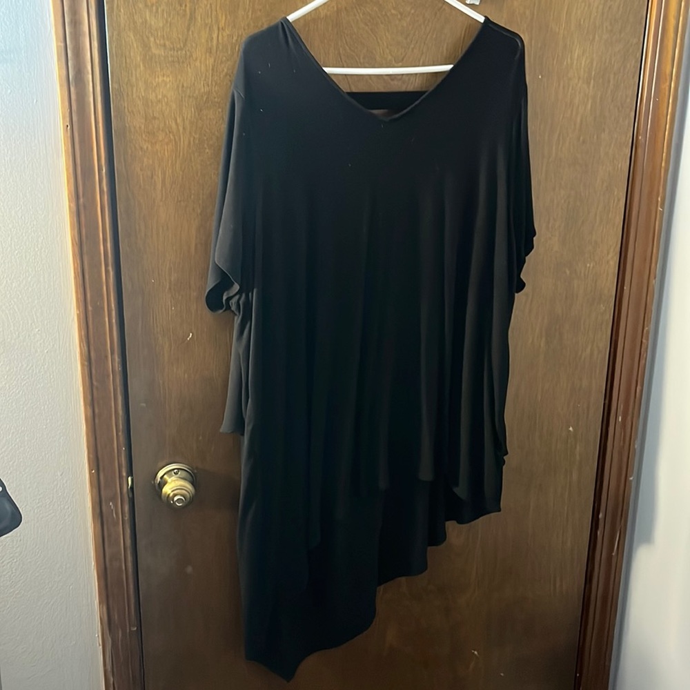 3 short sleeve shirts long in the back, shorter in the front.